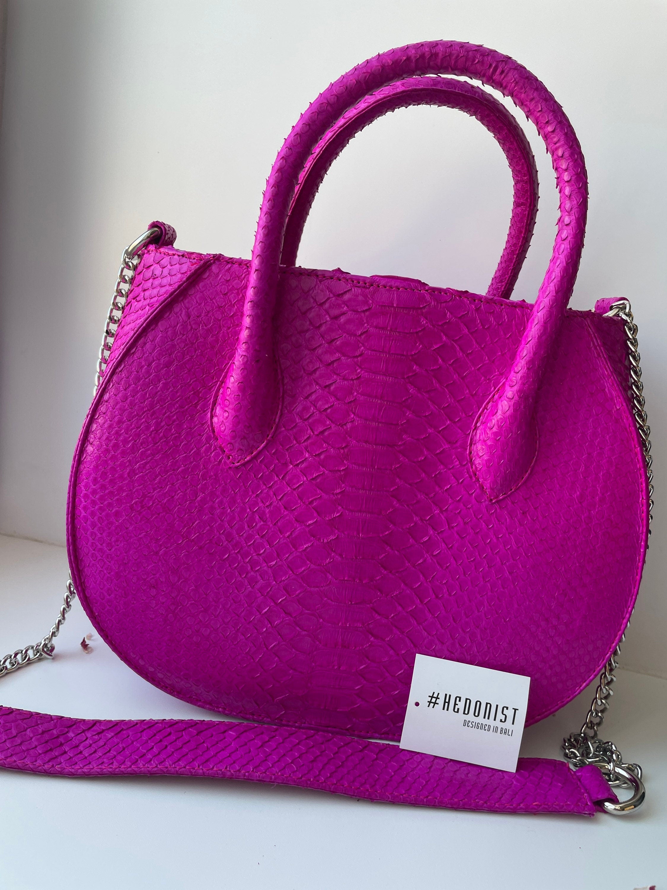 Genuine python skin top handle fuchsia bag