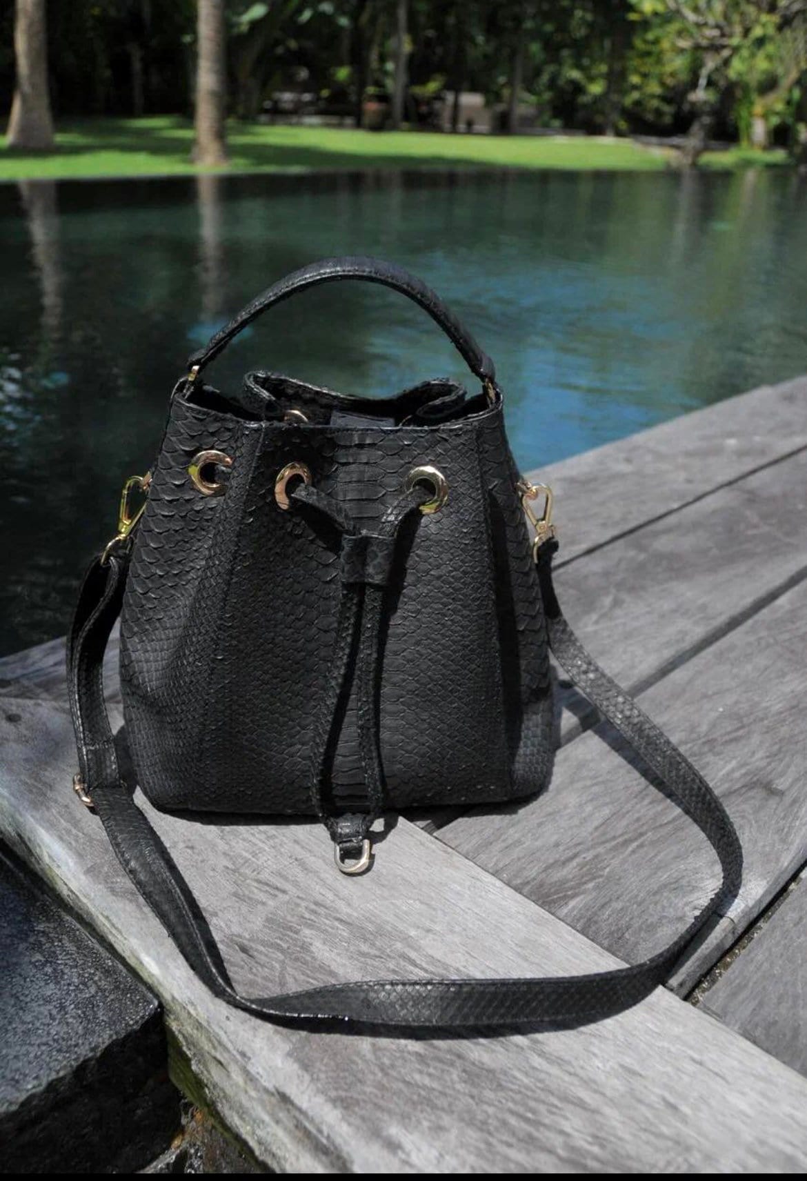 Genuine python skin black bucket crosshandle bag