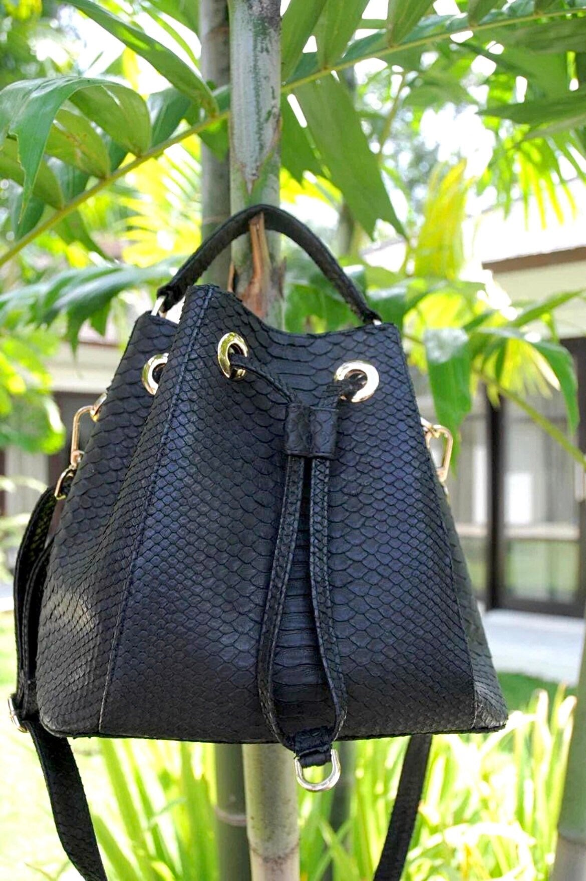 Genuine python skin black bucket crosshandle bag